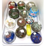 An unusual collection of vintage glass paperweights, some sliced with shaped forms, all with various