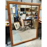 A large modern rectangular pine framed mirror, bevelled glass 104 x 134cm