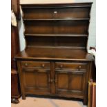 An Ercol modern high back dresser with plate rack over double cupboards, height 161cm, length 120cm