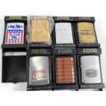 Seven various Zippo lighters, weapons/cigarettes:  Mauser Sporting gun ; Smith & Wesson;