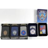 Three American Police Department Zippo lighters in matt finish, two New York, 1 Los Angeles, an