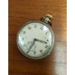 An early/mid 20th century military keyless open faced pocket watch, stamped: "GS/TP 012318