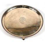 A hallmarked silver salver with rope twist border on three feet with Royal Lancashire Agricultural
