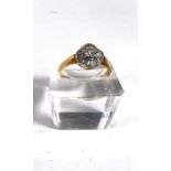 A lady's gold dress ring set with central diamond surrounded by a wavy band of baguette diamonds,