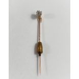 A yellow metal stick pin set old cut diamond, approx diameter 5mm