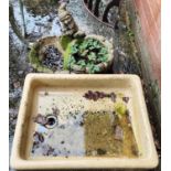 A stone sink/plater and a garden Gnome planter