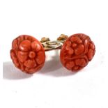A pair of screw back carved coral earrings in yellow metal fixtures, stamped 15c indistinctly, 4.