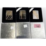 Three silver plated Zippo lighters with incised gilt decoration, boxed, Models 103WG, 102WG & 104WG