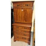 A reproduction mahogany dwarf secretaire/side cabinet with fall front and fitted interior over 4