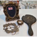 A hallmarked silver heart shaped photo frame; a hallmarked silver embossed hand mirror; etc.,