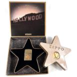 A Zippo lighter:  2001 Hollywood, with tin and boxed, lighter still with seal label
