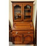 A cherrywood bureau bookcase with fall front, single drawer and double cupboard to base