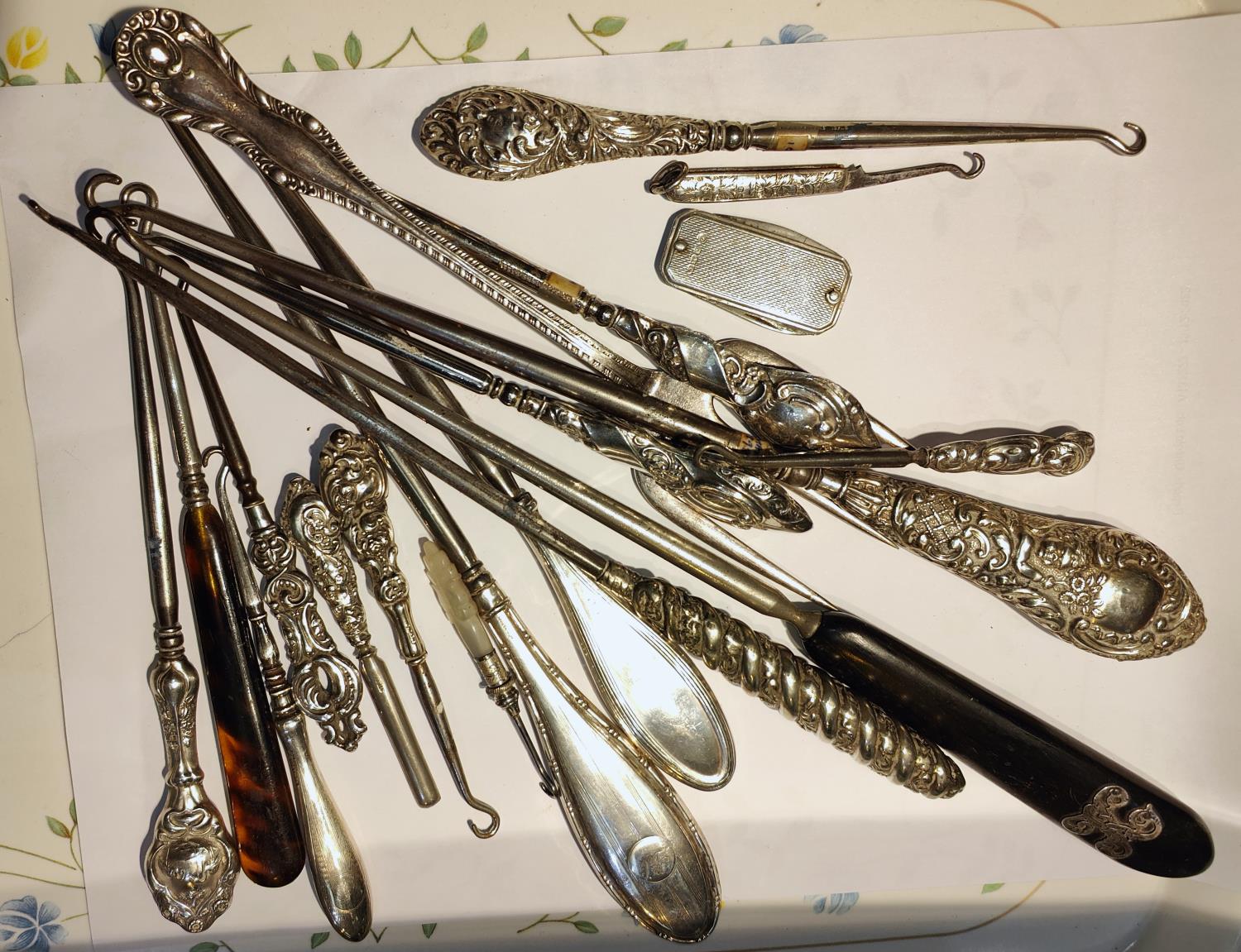 A collection of silver and other handled button hooks