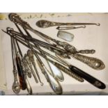 A collection of silver and other handled button hooks