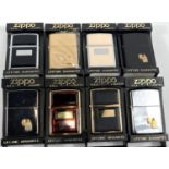 Eight various Zippo lighters:  4 regular model 35 black elegance, golden tortoise 355 ultralite back