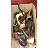 A selection of meerschaum pipes, some cased