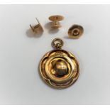 A 9 carat hallmarked gold medallion; 3 studs stamped '9ct'