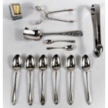 A set of 6 hallmarked silver teaspoons; a pair of sugar tongs, a pair of sugar nips, a thimble and