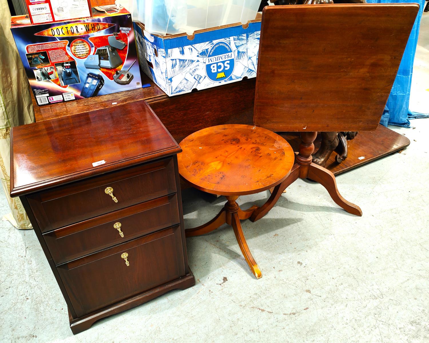 A reproduction mahogany three draw chest, a square tilt top occasional table and another table