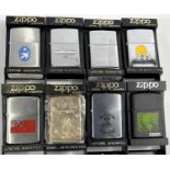 Eight various Zippo lighters:  matt black holographic globe; Singapore, brass; Guam; Hong Kong 1997;