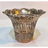 A hallmarked silver pierced vase holder of flared form, with scroll border, Chester 1902, 6.5oz