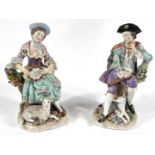 A pair of Sitzendorf figures in 18th century dress:  boy with flute and dog, girl with tambourine