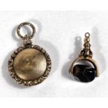 A yellow metal fob set with headstone; a yellow metal pendant mourning locket opening to woven