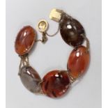 A bracelet formed from oval multicoloured polished agate links, unmarked, clasp tests as circa 9