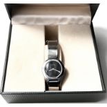 A lady's Gucci wristwatch, chromium plated on matching bracelet, in original box with 'lifetime'