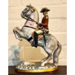 A Bavarian china figure depicting a soldier on horse back "West German", height 28cm