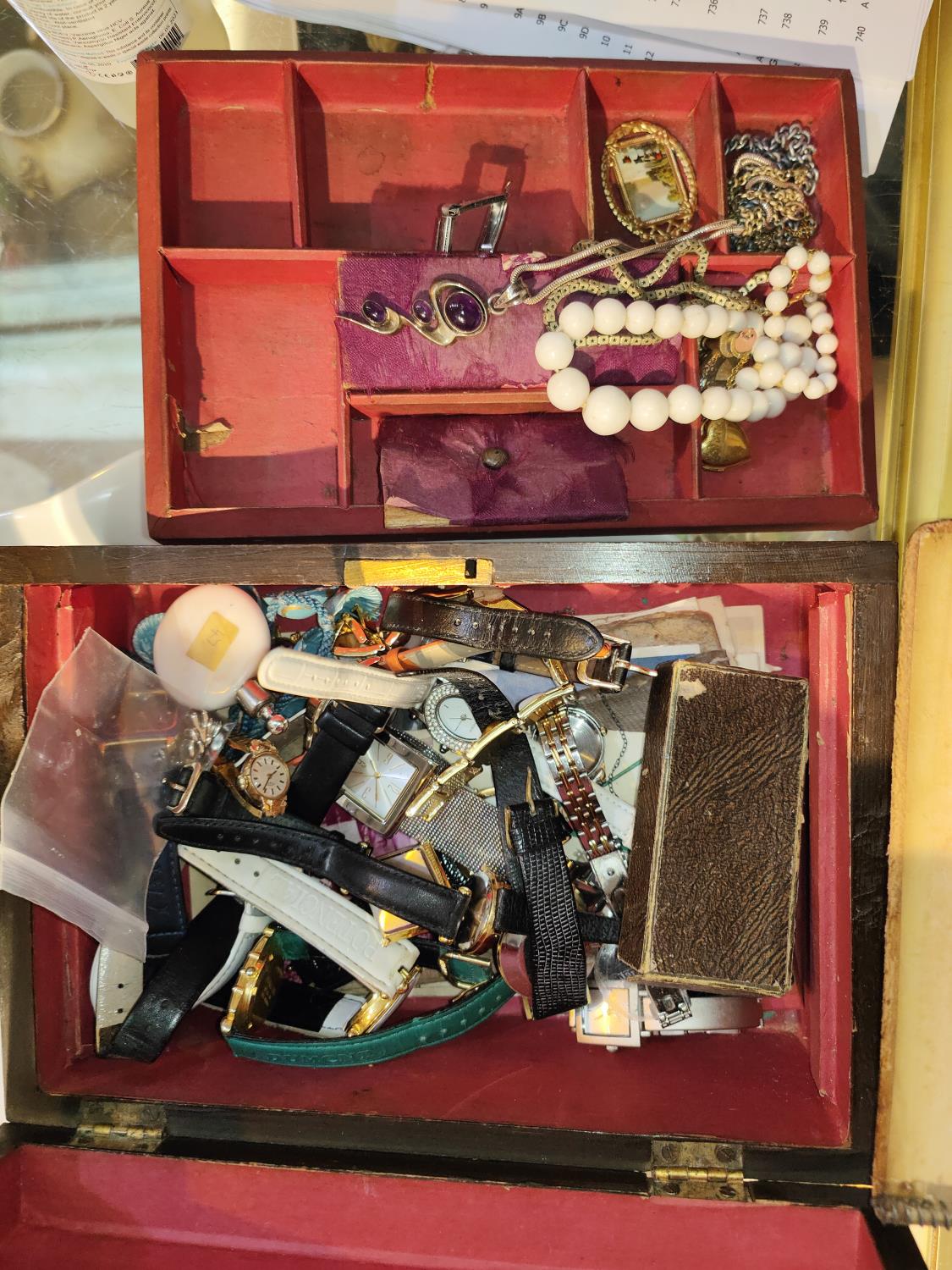 A selection of costume jewellery and watches in box