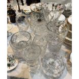 A pair of heavy cut glass celery vases, a large cut glass vase with wasted middle, various heavy cut