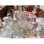 A selection of cut and sliced decanters, other various glassware