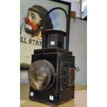 A 19th century railway lamp in japanned black metal