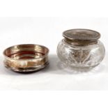 A hallmarked silver coaster by Cars, a silver lidded cut glass trinket jar and a napkin ring