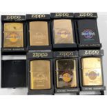 Seven Zippo Hard Rock Café lighters:  a matt black San Francisco; 6 brass - 2 x Montreal; Orlando;