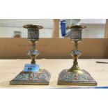 A pair of Arts & Crafts unusual candlesticks in brass and copper with bust portraits to base, height