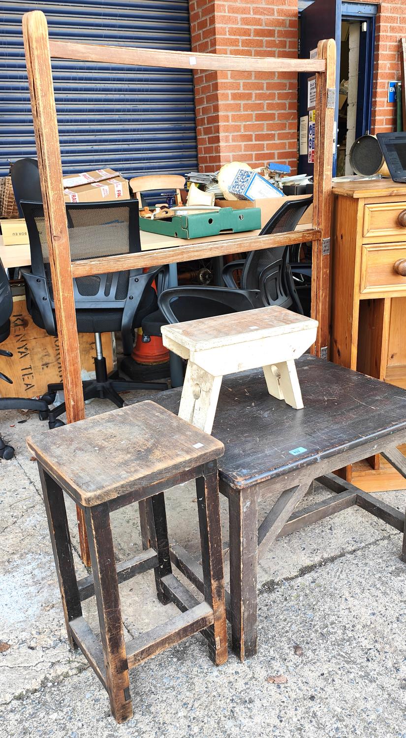 A stained pine occasional table, a similar stool/stand, a smaller stool and a vintage drying rack