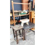 A stained pine occasional table, a similar stool/stand, a smaller stool and a vintage drying rack