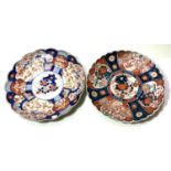 A pair of Imari circular wall plaques with scalloped borders, diameter 31cm