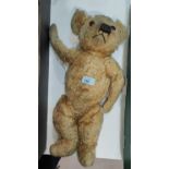 A vintage Merrythought Teddy Bear (name tag on foot) (worn)