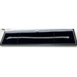 A 9 carat white gold ‘Tennis Bracelet’ set 42 diamonds (approximately 2 - 3 carats, each