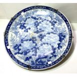 A large 19th/20th century Japanese blue and white charger decorated with birds and flowers, diameter