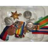 A WWI silver war medal to M2-156565 Pte J.A. MCCARTNEY, A.S.C.; a silver war badge 100390 and a