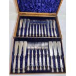 An oak cased set of elegant pearl handles and silver plated fish knoves and forks, 12 setting with
