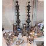 A pair of silver on copper rococo style candle sticks with lids, height 39cm; a pair of silver