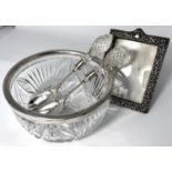 A vintage silver picture frame 17x13cm and a silver plated rimmed salad bowl and plated servers