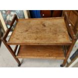 A 1960's teak 2 tier tea trolley; an oak small occasional table with drop leaf top