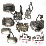 A selection of plated and white metal and ceramic bottle labels and a pair of white metal and