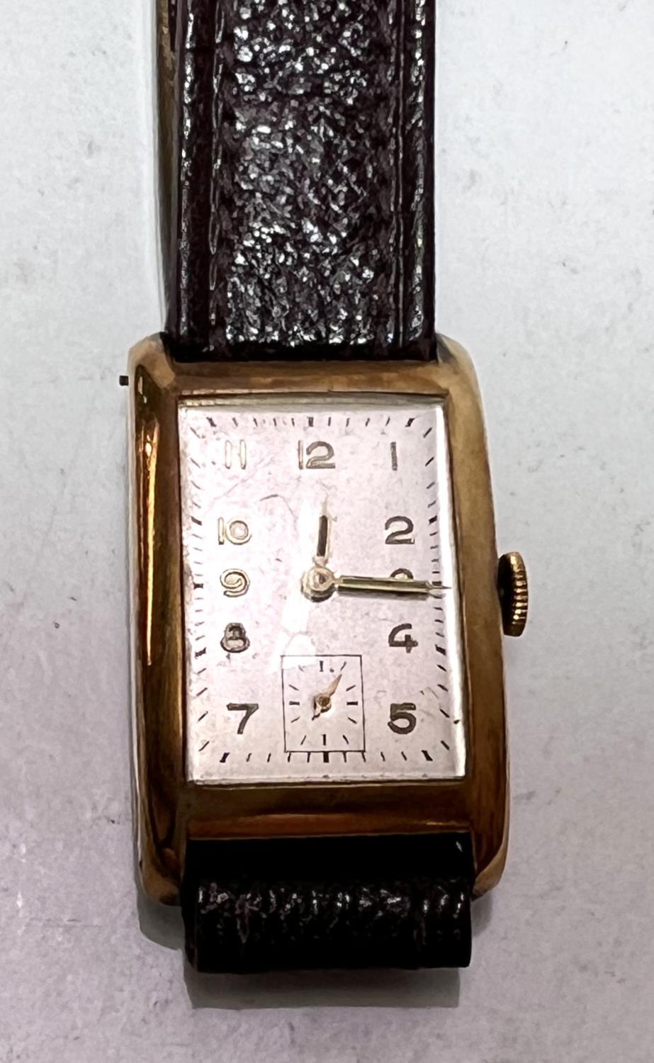 A 1930's gent's Tank watch with 18 carat gold case with Arabic numerals and seconds complication